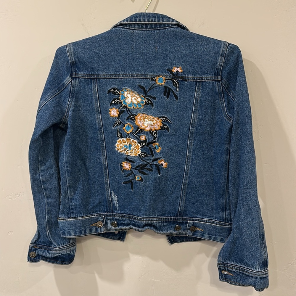 Denim Jean jacket with floral decal in the back